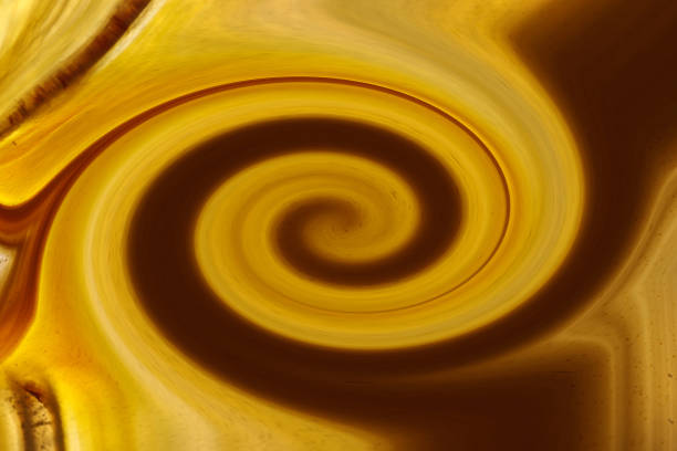 Abstract background from yellow and brown colors with a spiral pattern.