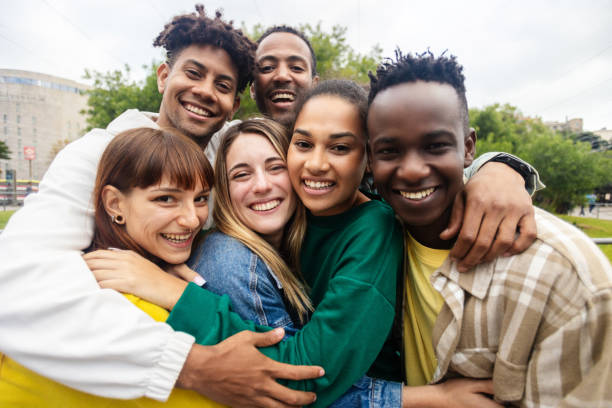 istock Portrait group of happy young student friends smiling at camera 2112994002