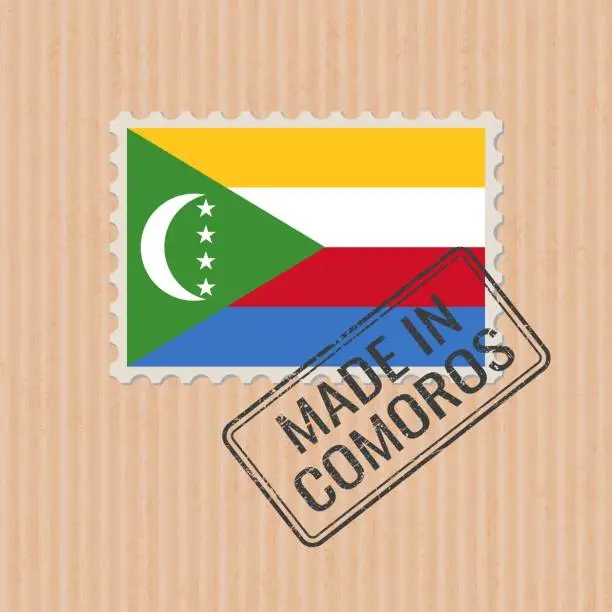 Vector illustration of Made in Comoros badge vector. Sticker with Comoros national flag. Ink stamp isolated on paper background.
