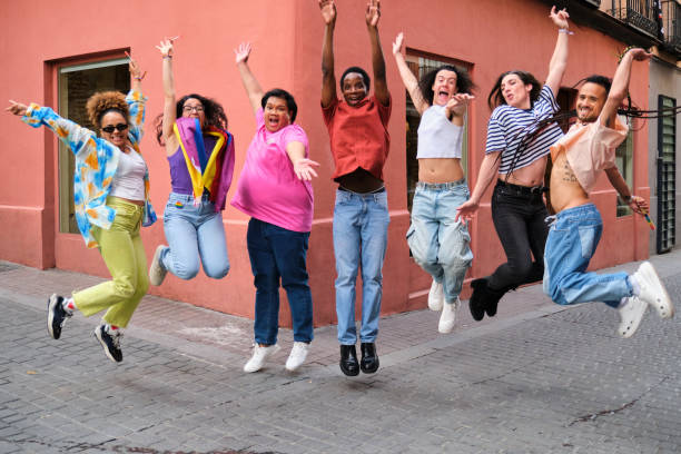 istock LGBTQ people are jumping up while holding a rainbow flag celebrating Pride Day. 2113060567