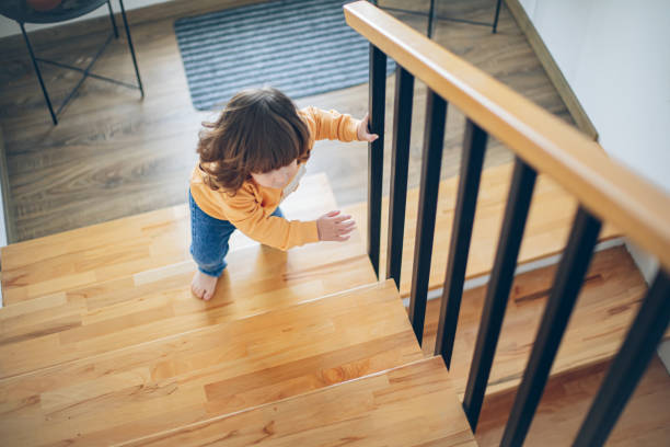 istock Cute toddler boy climbing the stairs by himself 2113089980