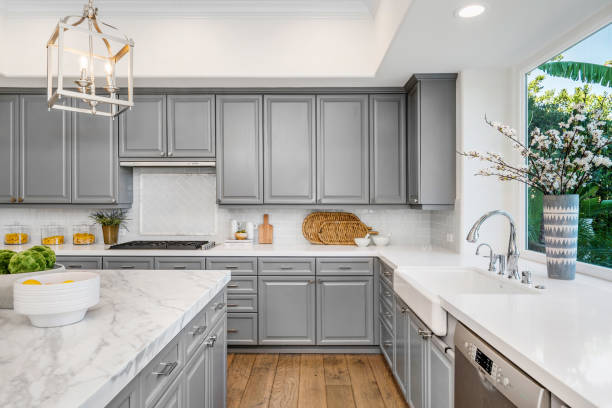 istock Spacious modern kitchen with marble countertops, cabinets, and hardwood floors 2113095258