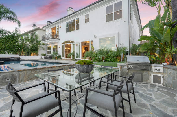 istock Modern house with a patio and a pool at sunset 2113098387
