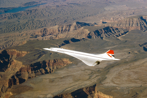 British Airways Concorde airplane in flight on a charter flight over the US Southwest. Photographed between 1977 and 1984.