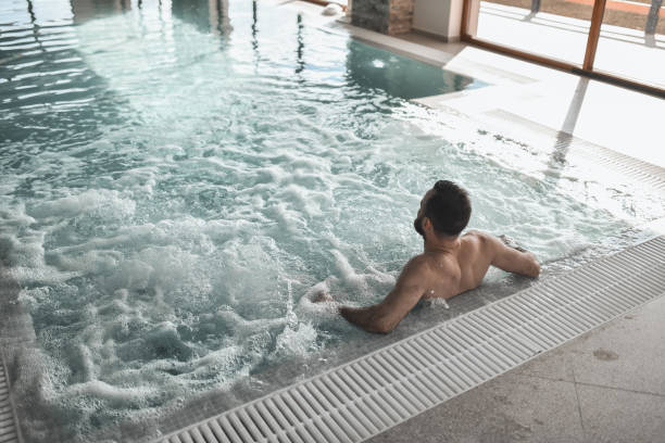 istock Foaming Water Underneath Male Sitting In Swimming Pool 2113175987