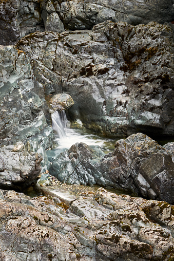 A tiny waterfall amongst beautiful rugged rocks at Harris Creek