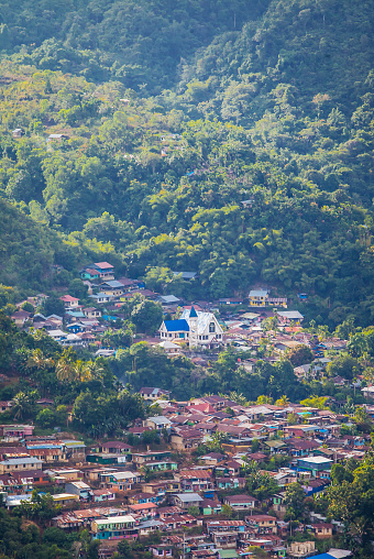 Settlement in one part of Jayapura City. Jayapura is the capital of Papua Province in Indonesia. This housing complex is sandwiched between hills and mountains.