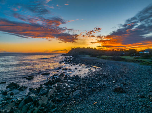 istock Coastal Sunrise with Rock Formations 2113247792