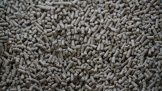 A closeup shot of a pile of grained wood pellets, perfect for food preparation