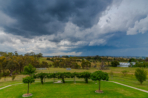 Early evening Summer Storm approaching over the fields on a rural property at Blayney in the Central West of NSW, Australia.