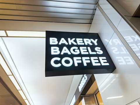 Bakery shop sign with bagels and coffee text