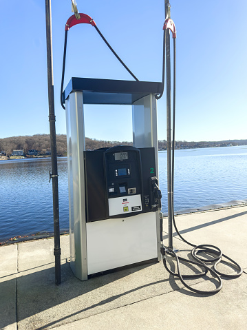 Gas pump on a deck in a marina in a lake