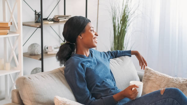 istock Coffee relax weekend rest home woman cup couch 2113345157