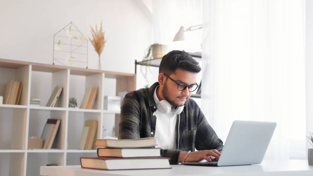 istock Remote employee internet research man laptop home 2113346262