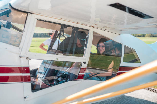 istock Diverse Tourists Smiling in Small Airplane Before Takeoff 2113346787