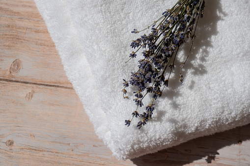 Dried lavender flowers on cotton towel. Esthetic aesthetic composition with copy space for wallpaper, black, template. Minimal eco style still life concept