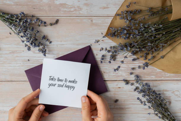 istock TAKE TIME TO MAKE YOUR SOUL HAPPY text on supportive message paper note reminder from green envelope. Flat lay composition dry lavender flowers. Concept of inner happiness, slowing-down digital detox personal fulfillment 2113400159