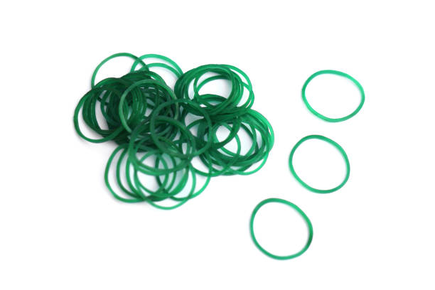 istock Elastic green rubber bands in ring or oval shape on white background. Concept, equipment that use for tie multiple objects together, use in office or household item that can be used in various purpose 2113440488