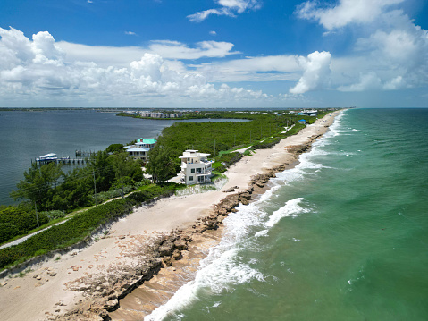 Aerial coastline view with homes at Stuart Rocks Beach in Stuart, Florida in Martin County