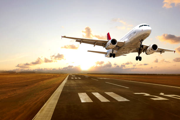istock Passenger airplane is taking off at dusk 2113451130