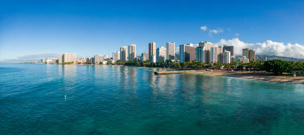 Aerial view of the skyline of Honolulu with Waikiki Beach, the skyscrapers and the mountains in the background. Panorama with extremely high resolution - Oahu, Hawaii
