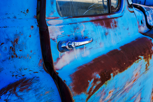 Colorful Rusty Distressed Old Truck - Vehicle left outdoors to the elements weathered and rusty.