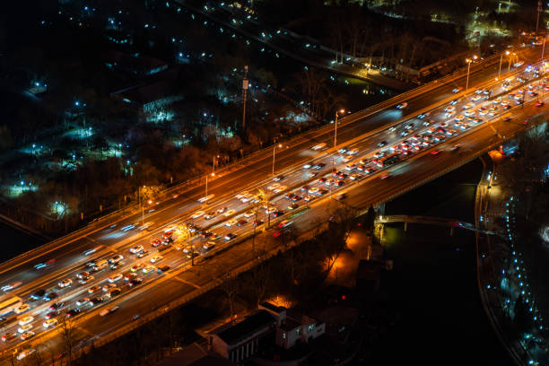 istock night street traffic road traffic lights 2113571428