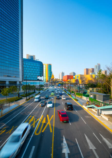 Shanghai, China - March 2nd 2024: view of Jing'an Temple and traffic, Jingan Temple is a Buddhist temple on the West Nanjing Road in Shanghai, China. Jingan District, where it is located, is named after the temple.