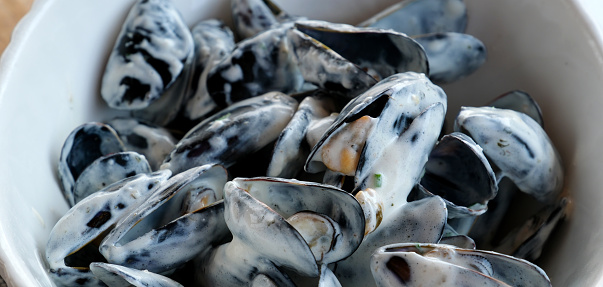 close up of marinieres mussels, a French recipe with shallot and white wine. High quality photo
