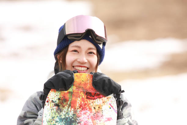 istock snowboarding wear women 2113712036