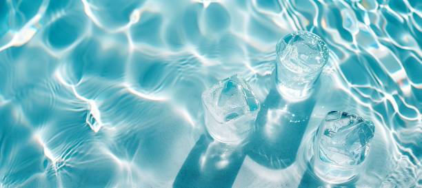 shadow on water surface white sand beautiful abstract background summer vacation light blue translucent ice cube
