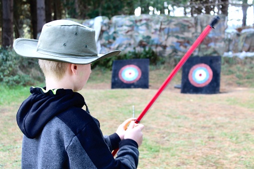 Child practising archery with targets