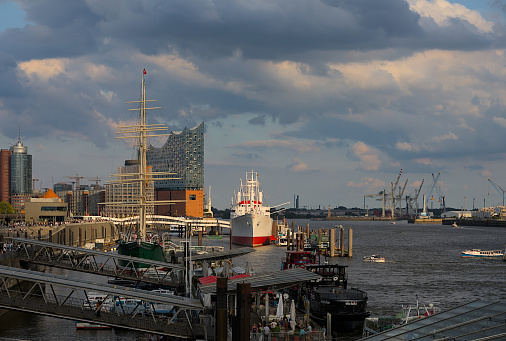 Hamburg, Germany - 08/26/2023: Hamburg harbor panorama with the museum ship, the Cap San Diego, the Elbphilharmonie and the Elbe River