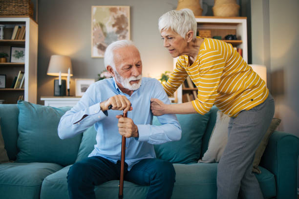 istock Senior woman helping her husband to get up. 2113809748