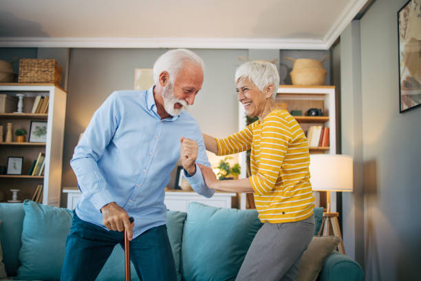 istock Senior woman helping her husband to get up. 2113813797