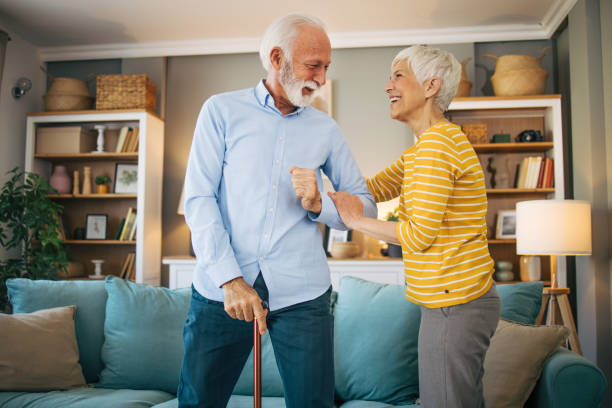 istock Senior woman helping her husband to get up. 2113814303