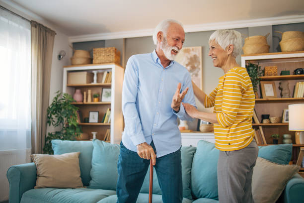 istock Senior woman helping her husband to get up. 2113815851