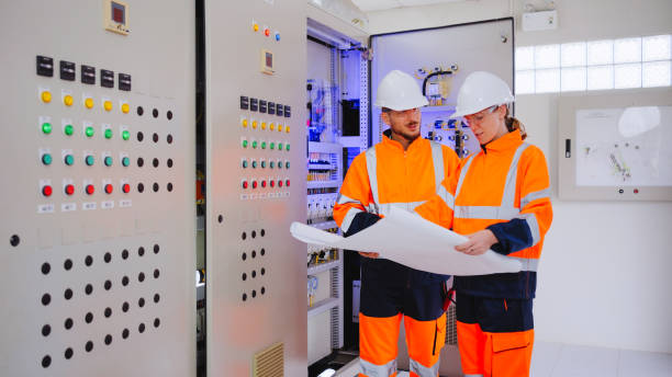 istock Engineer and foreman working at control room of water treatment plant. 2113823059
