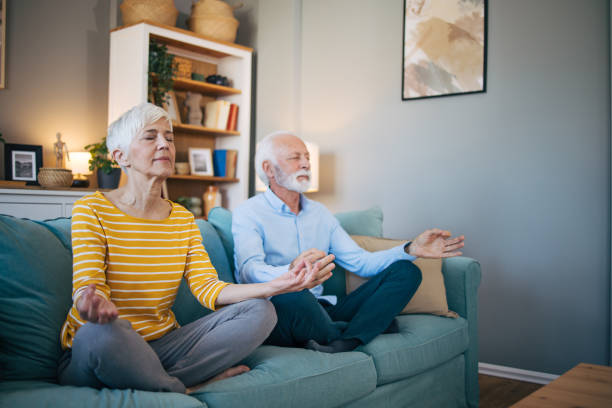 istock Senior couple meditate together 2113824116