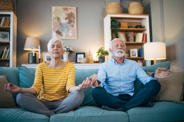 istock Senior couple meditate together 2113824130