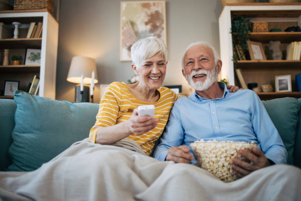 istock Senior couple watching TV 2113829285