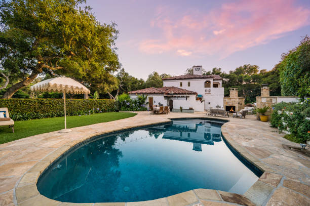 istock a large home with a large swimming pool in front of it 2113848182