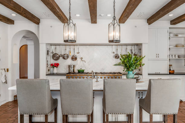 istock a kitchen with white walls and wooden beams, counters and chairs 2113848187