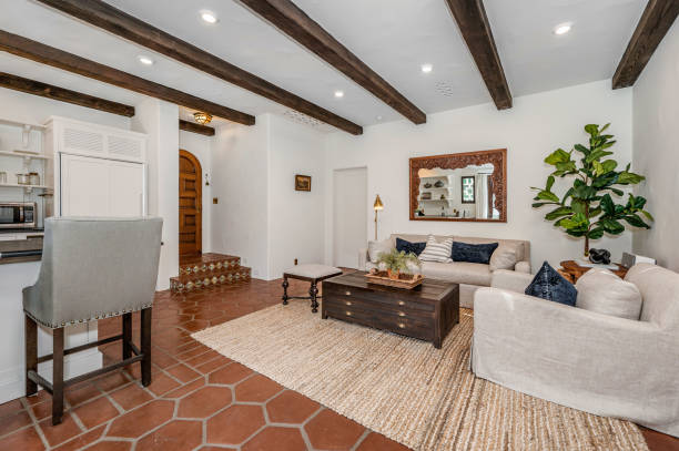 istock a living room with a white couch and two chairs next to a kitchen 2113848716