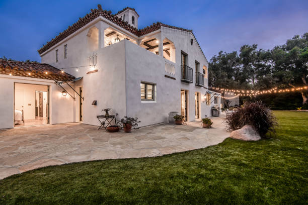 istock this home has white stucco and decorated with outdoor string lights 2113855436