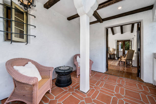 istock the inside of a home decorated in white with wicker chairs 2113856472