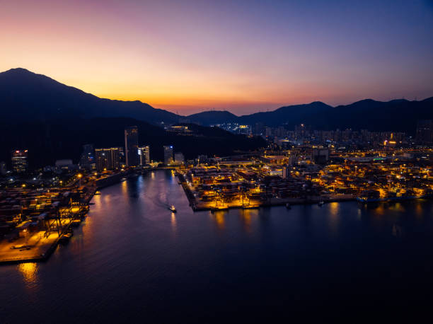 istock Aerial view of container terminal at night 2113858540