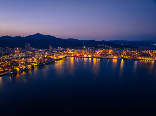 istock Aerial view of container terminal at night 2113860096