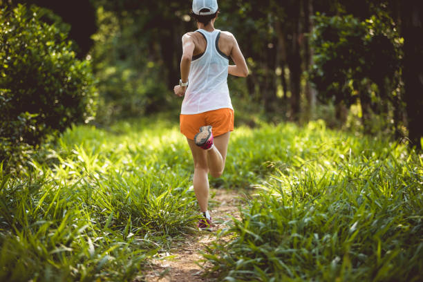 istock Trail runner running in summer forest trail 2113886926