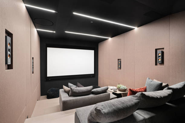 istock a room with couches, chairs and television mounted on the wall 2113904813